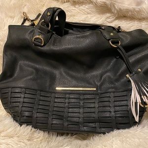 Steve Madden® Flat Tote faux leather handbag with an additional zipper bag.